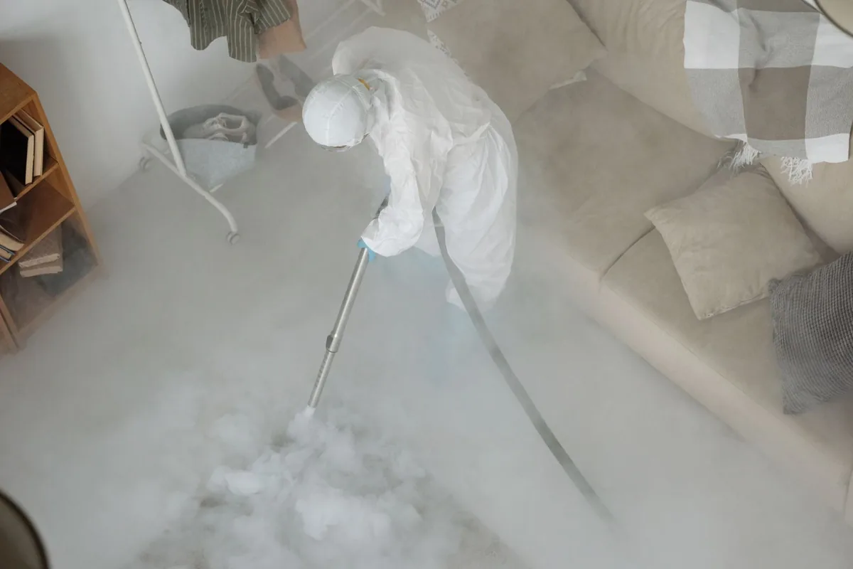 Biohazard cleanup technician in protective equipment, Patterson, LA